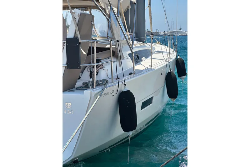  Yacht Photos Pics 2020 Dufour 430 sailboat docked in clear blue water, side view.