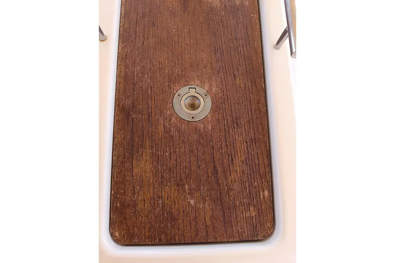  Yacht Photos Pics Wooden deck detail of 2020 Dufour 430 sailboat with metal fixture.