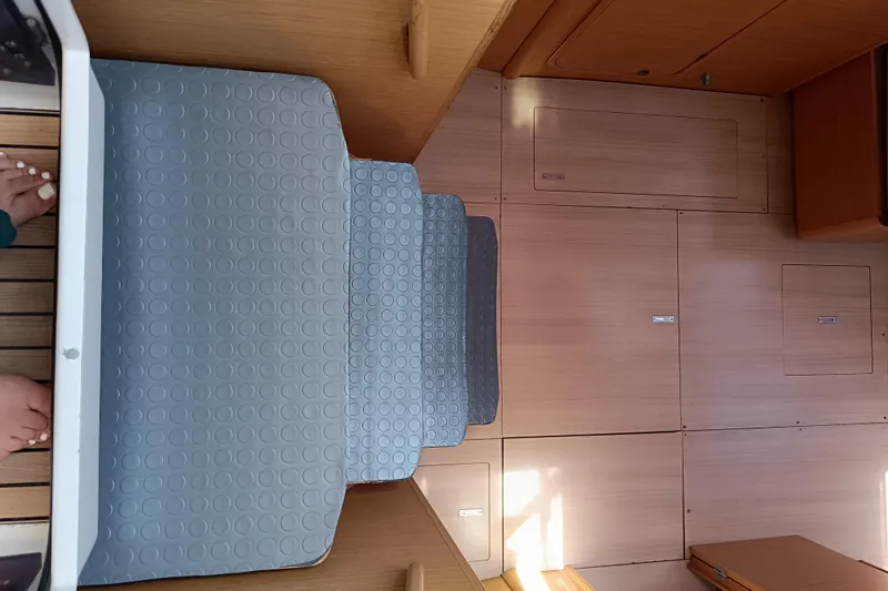  Yacht Photos Pics Interior view of 2020 Dufour 430 yacht with wooden flooring and cushioned steps.