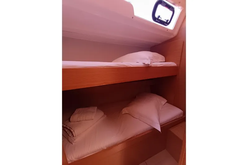  Yacht Photos Pics Bunk beds in a 2020 Dufour 430 yacht cabin with natural wood finish.