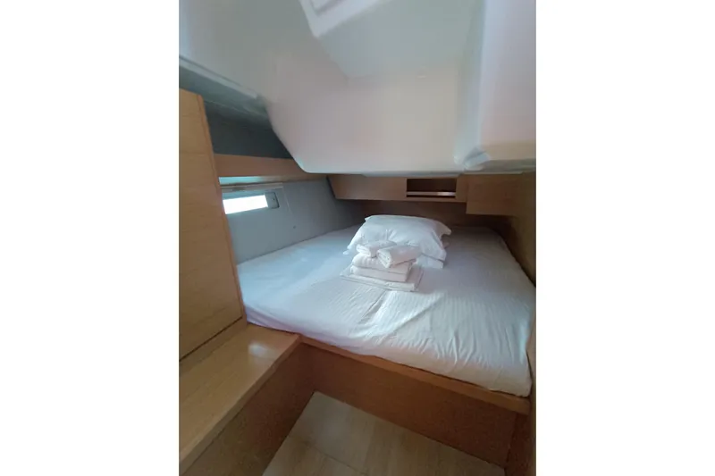  Yacht Photos Pics Cozy cabin interior of 2020 Dufour 430 yacht with neatly arranged bedding.