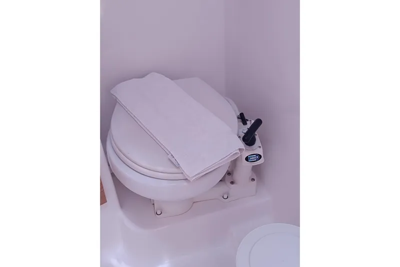 Yacht Photos Pics Marine toilet in 2020 Dufour 430 yacht bathroom, featuring Jabsco pump handle.