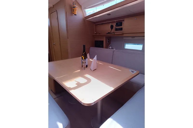  Yacht Photos Pics Interior of 2020 Dufour 430 yacht with dining table and seating area.