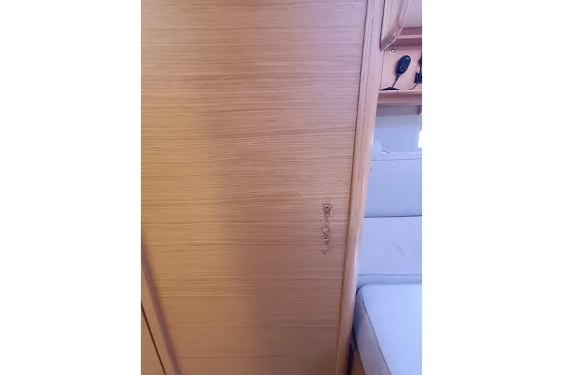  Yacht Photos Pics Wooden interior panel with scratch in 2020 Dufour 430 yacht cabin.