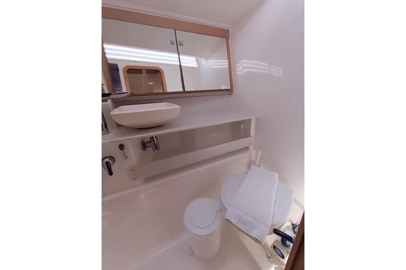  Yacht Photos Pics Bathroom interior of 2020 Dufour 430 yacht, featuring modern sink and mirror.