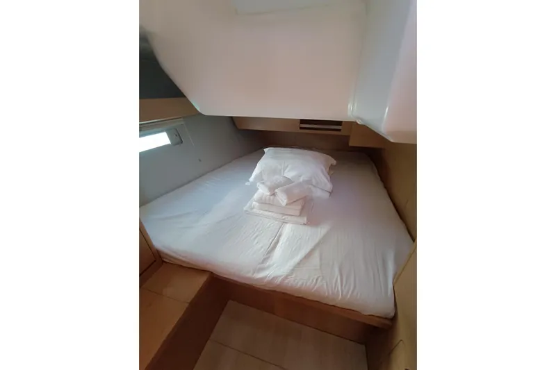  Yacht Photos Pics Cozy cabin interior of 2020 Dufour 430 yacht with neatly arranged bedding.