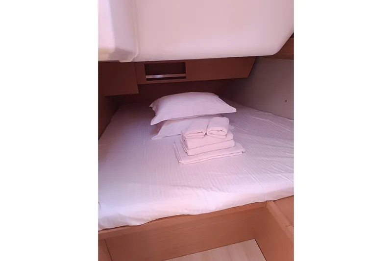  Yacht Photos Pics Cozy cabin interior of 2020 Dufour 430 yacht with neatly arranged bedding.
