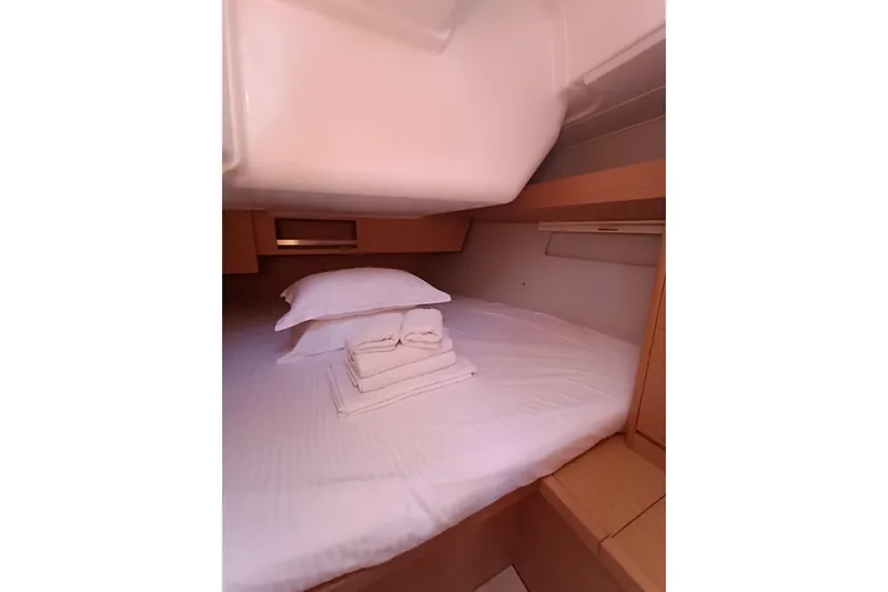  Yacht Photos Pics Cozy cabin interior of 2020 Dufour 430 yacht with neatly arranged bedding.