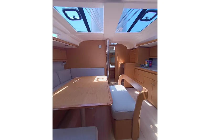  Yacht Photos Pics Interior of 2020 Dufour 430 yacht, featuring a spacious dining area with skylights.