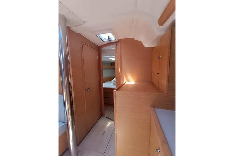  Yacht Photos Pics Interior of 2020 Dufour 430 yacht, featuring wooden cabinetry and a skylight.