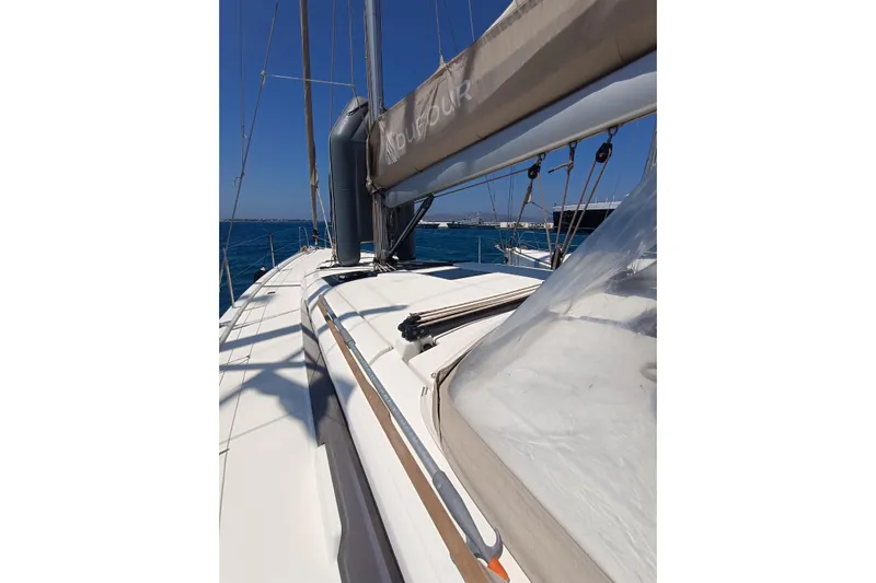 Yacht Photos Pics 2020 Dufour 430 sailboat deck with clear skies and blue sea.