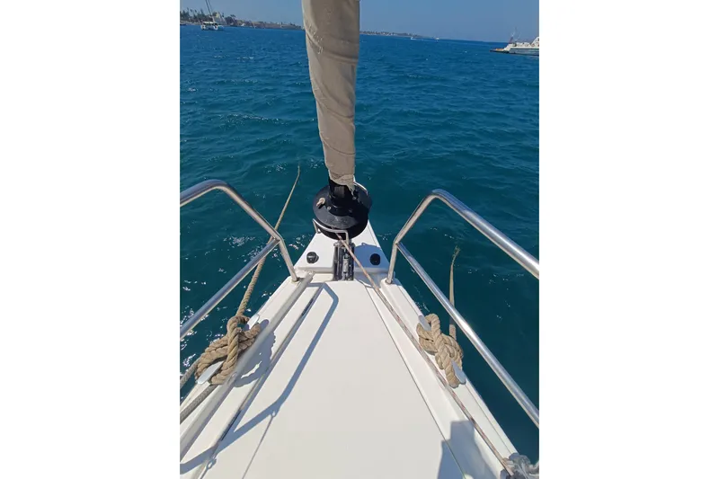  Yacht Photos Pics Bow view of 2020 Dufour 430 sailboat on clear blue water.