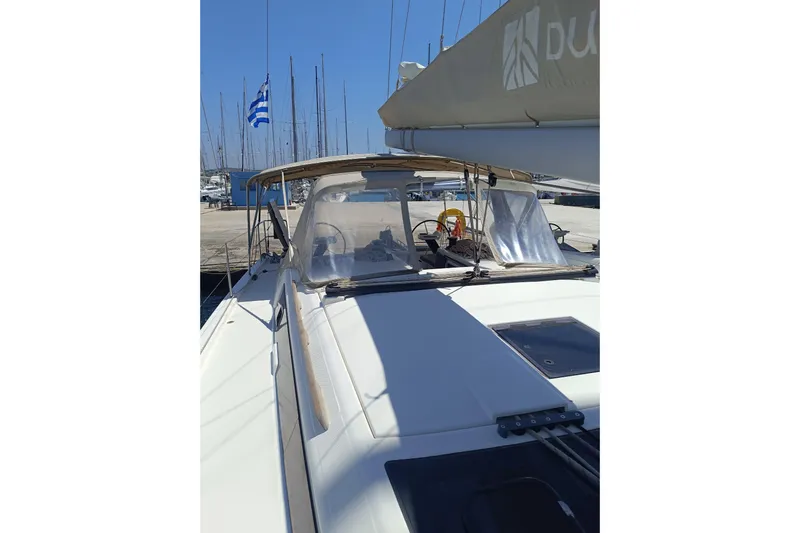  Yacht Photos Pics Dufour 430 sailboat, 2020 model, docked with Greek flag, sunny day.