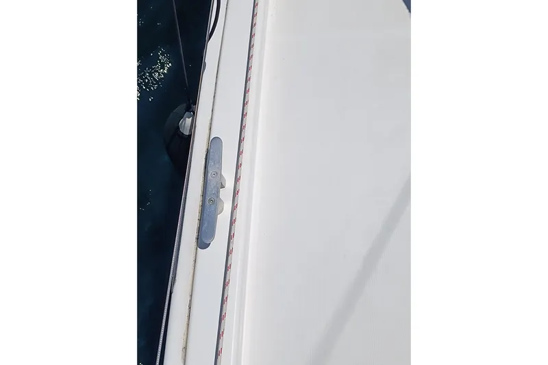  Yacht Photos Pics Close-up of a 2020 Dufour 430 yacht deck with cleat and rope detail.