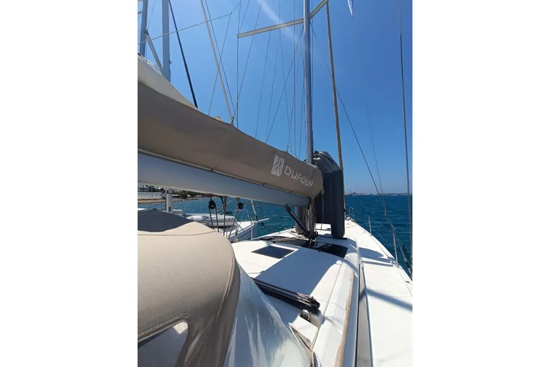  Yacht Photos Pics 2020 Dufour 430 sailboat deck view with mast and boom in sunny weather.
