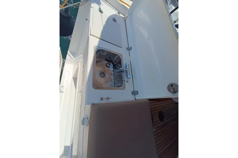  Yacht Photos Pics Outdoor sink on 2020 Dufour 430 yacht with open storage compartment.