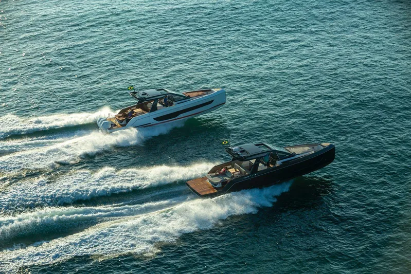  Yacht Photos Pics Two Schaefer V44 boats cruising on open water, 2026 model.