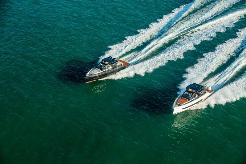  Yacht Photos Pics Two Schaefer V44 yachts from 2026 cruising on clear blue water.