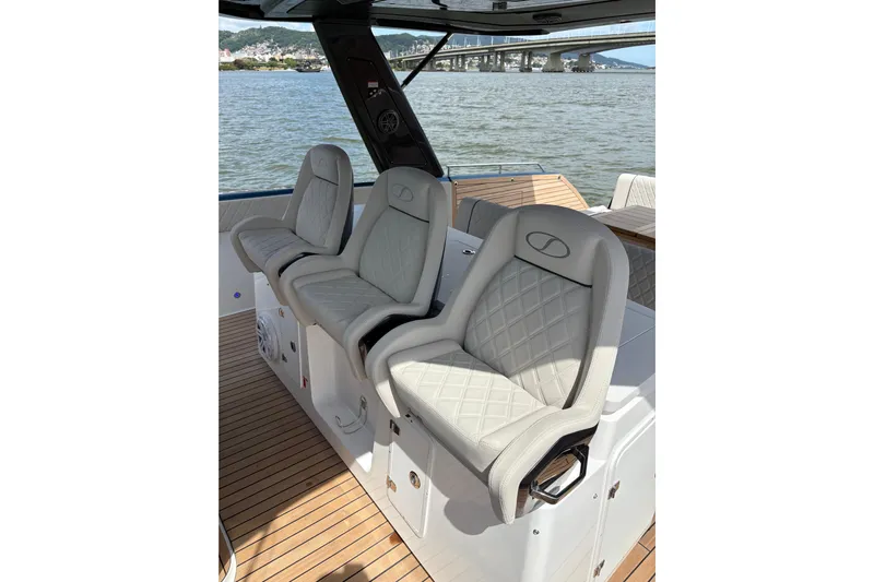  Yacht Photos Pics Luxurious seating on 2026 Schaefer V44 yacht with elegant design and waterfront view.