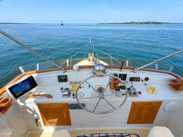 Argonaut Yacht Photos Pics Helm of 1984 Wilbur 38 boat with ocean view and navigation equipment.