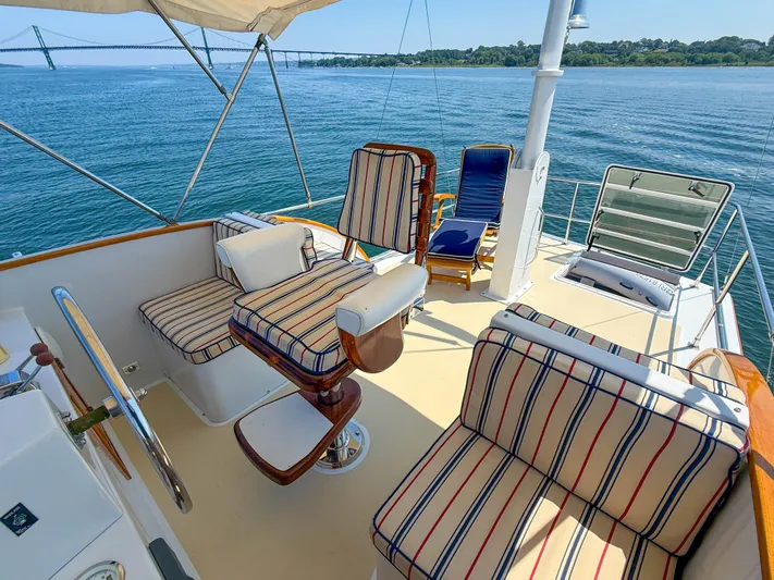 Argonaut Yacht Photos Pics Luxury seating on 1984 Wilbur 38 yacht with scenic ocean view.