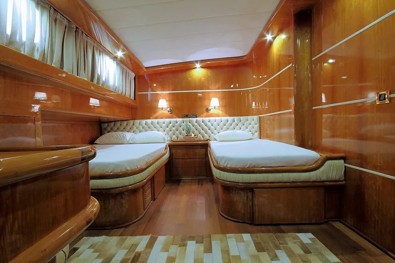 Silvermoon Yacht Photos Pics Luxurious wooden cabin interior of 2010 Custom Gulet Motorsailer with twin beds and elegant lighting.
