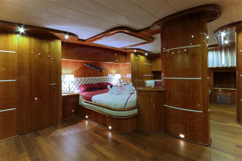 Silvermoon Yacht Photos Pics Luxurious wooden interior of 2010 Custom Gulet Motorsailer bedroom with elegant lighting.