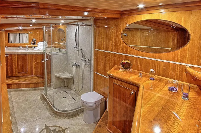 Silvermoon Yacht Photos Pics Luxurious bathroom on 2010 Custom Gulet Motorsailer with wood accents and modern fixtures.