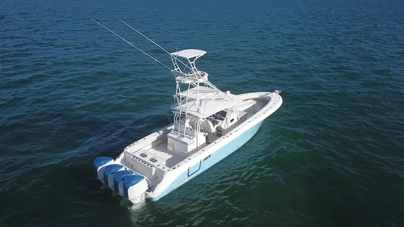  Yacht Photos Pics 2014 Hydra-Sports 42 boat on open water, featuring triple outboard engines.