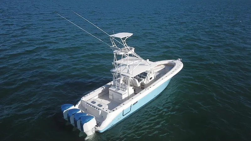  Yacht Photos Pics 2014 Hydra-Sports 42 boat on open water, featuring triple outboard engines.