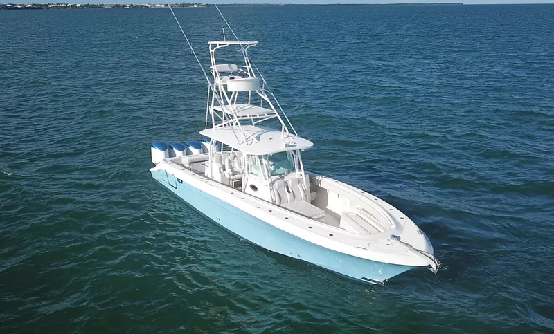  Yacht Photos Pics 2014 Hydra-Sports 42 boat on open water, featuring a sleek design and multiple outboard engines.