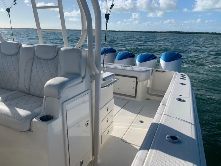  Yacht Photos Pics 2014 Hydra-Sports 42 boat interior with luxurious seating and multiple engines on open water.