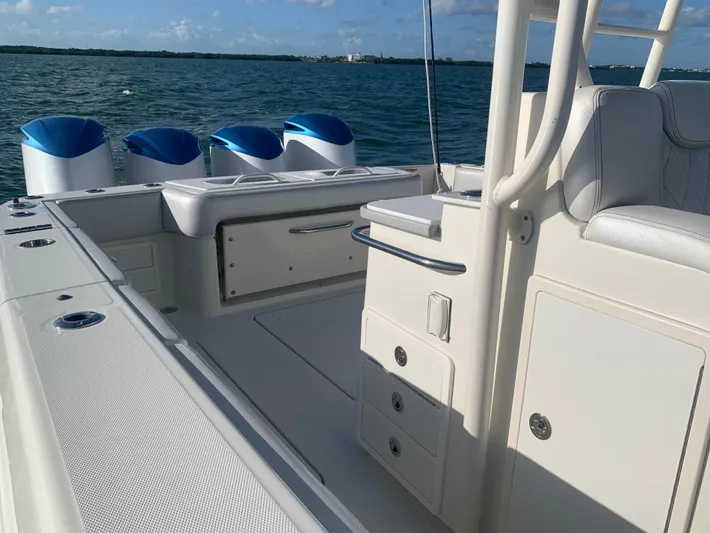  Yacht Photos Pics 2014 Hydra-Sports 42 boat interior with seating and storage, on a sunny day at sea.