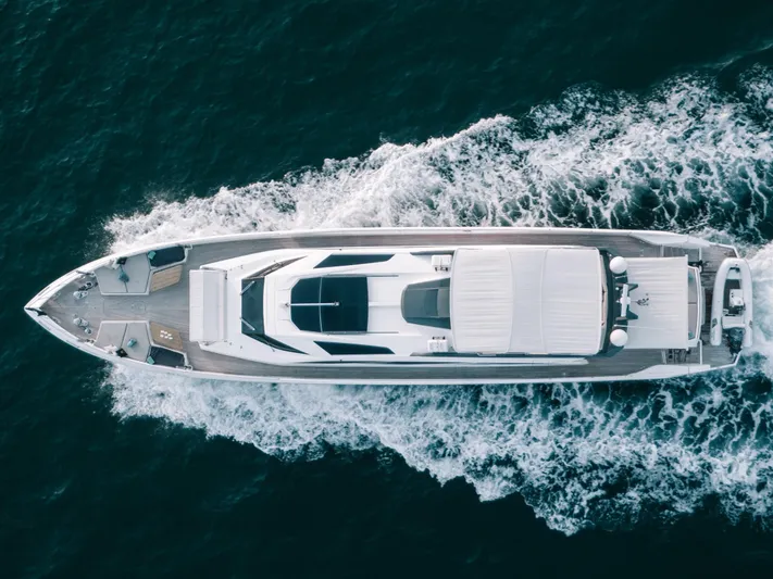  Yacht Photos Pics Aerial view of 2016 Numarine 105HT yacht cruising on the ocean.