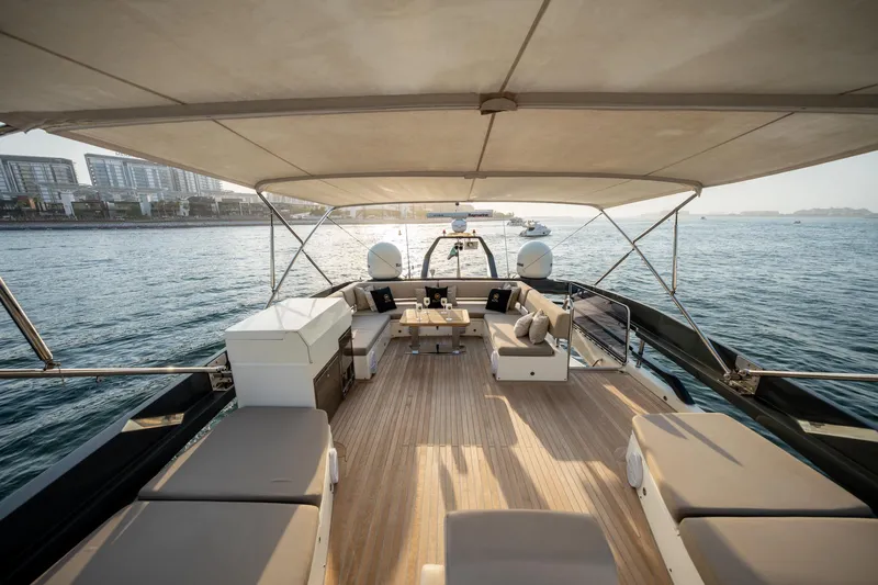  Yacht Photos Pics Luxurious 2016 Numarine 105HT yacht deck with seating, overlooking serene waters.