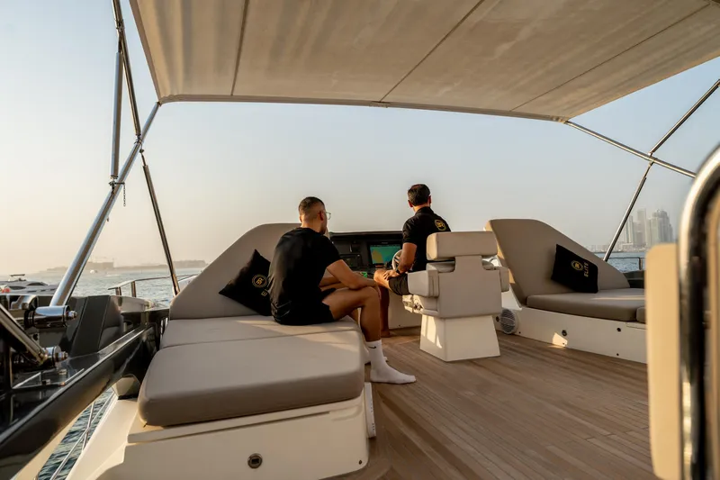  Yacht Photos Pics Two people relaxing on a 2016 Numarine 105HT yacht deck.