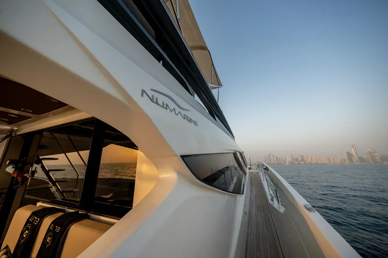  Yacht Photos Pics Luxury Numarine 105HT yacht cruising on open water, 2016 model.