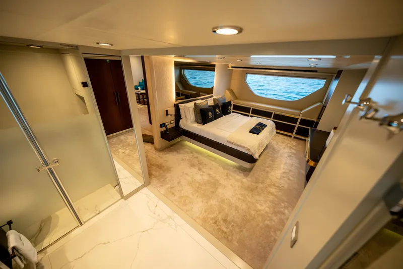  Yacht Photos Pics Luxurious interior of 2016 Numarine 105HT yacht with elegant bedroom and ocean view.