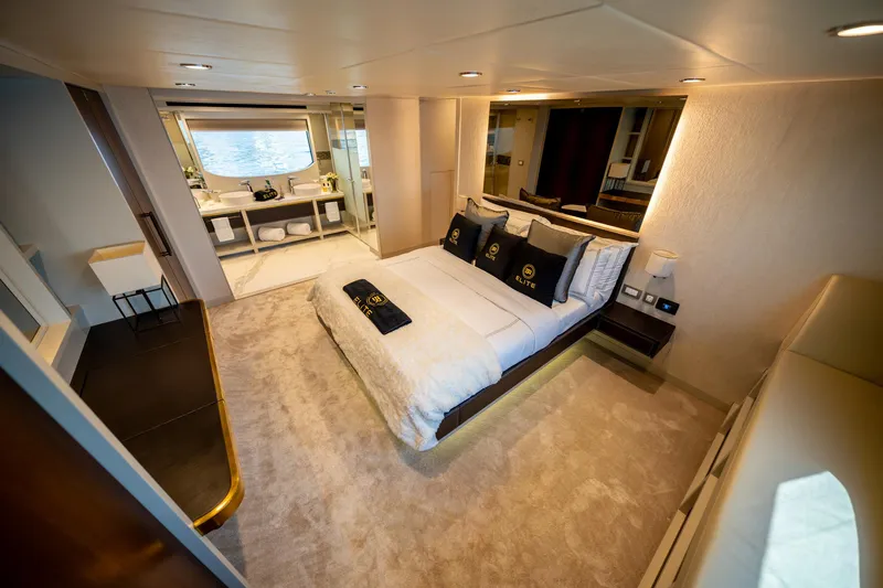  Yacht Photos Pics Luxurious bedroom interior of 2016 Numarine 105HT yacht with elegant decor and modern amenities.