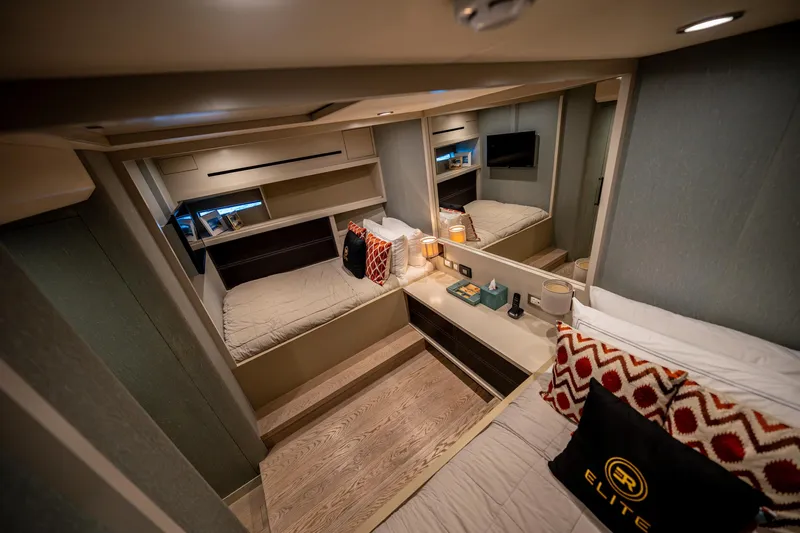  Yacht Photos Pics Luxurious cabin interior of 2016 Numarine 105HT yacht with modern decor and cozy bedding.