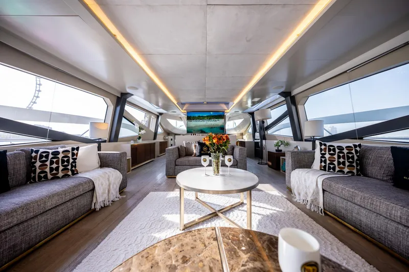  Yacht Photos Pics Luxurious interior of 2016 Numarine 105HT yacht with modern decor and panoramic windows.