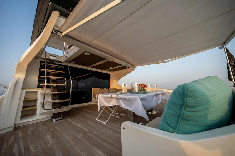  Yacht Photos Pics Luxurious 2016 Numarine 105HT yacht deck with elegant dining setup and modern design.