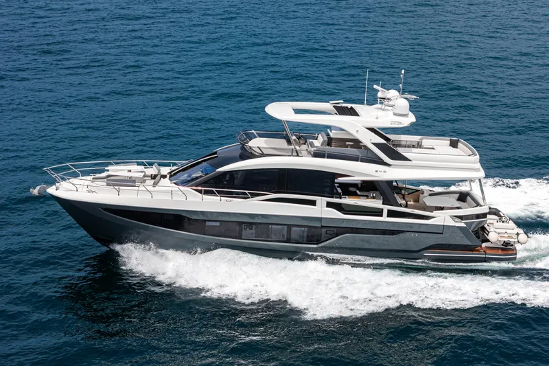  Yacht Photos Pics 2023 Galeon 640 Fly yacht cruising on open sea, showcasing sleek design and luxury features.