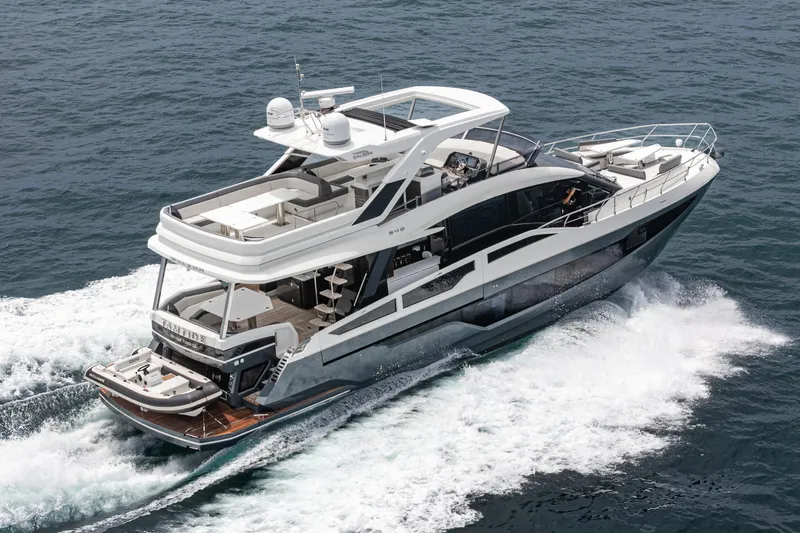  Yacht Photos Pics 2023 Galeon 640 Fly yacht cruising on open water, showcasing luxury design.