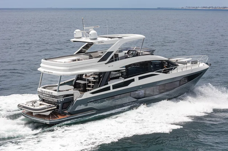  Yacht Photos Pics 2023 Galeon 640 Fly yacht cruising on open water, showcasing sleek design and luxury features.
