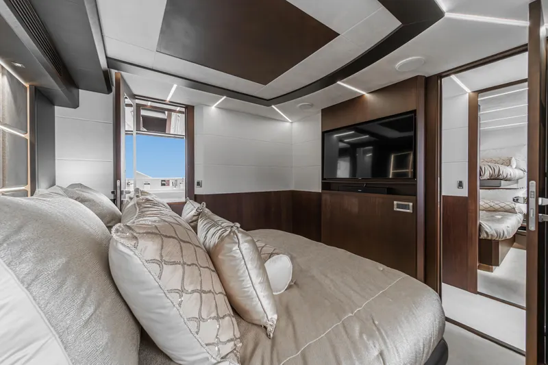  Yacht Photos Pics Luxurious bedroom interior of 2023 Galeon 640 Fly yacht with modern design and elegant furnishings.