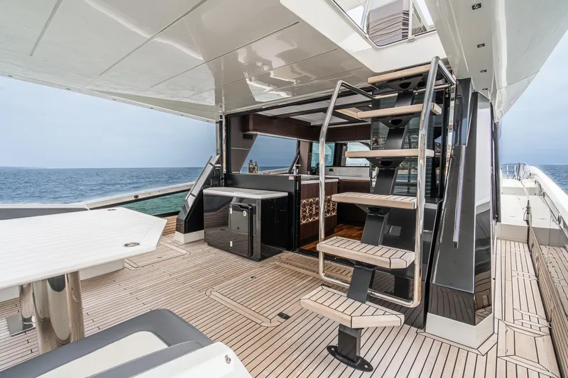  Yacht Photos Pics 2023 Galeon 640 Fly yacht deck with modern staircase and ocean view.