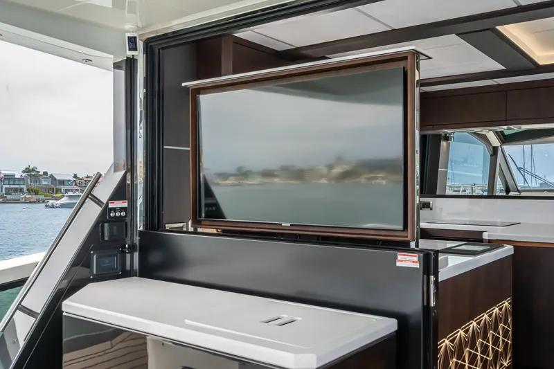  Yacht Photos Pics 2023 Galeon 640 Fly yacht interior with retractable TV and modern design.