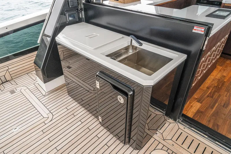  Yacht Photos Pics Luxury yacht Galeon 640 Fly 2023, featuring sleek outdoor kitchen with sink and modern design.