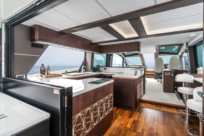  Yacht Photos Pics Luxurious interior of 2023 Galeon 640 Fly yacht with modern kitchen and ocean view.